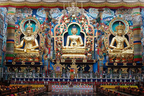 Gold plated statues of Buddha, Padmasambhava, and Amitayus in the Golden Temple, Namdroling Monastery