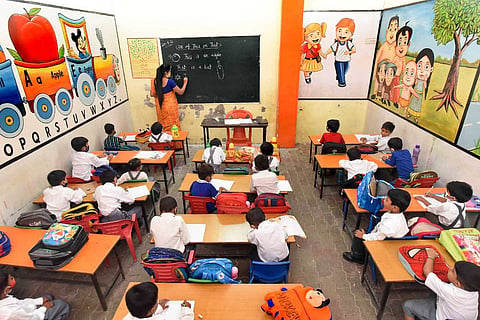 Children seated in a primary classroom during a lesson: NCERT was pulled up by Madras High Court, told to begin training on transgender inclusion next year