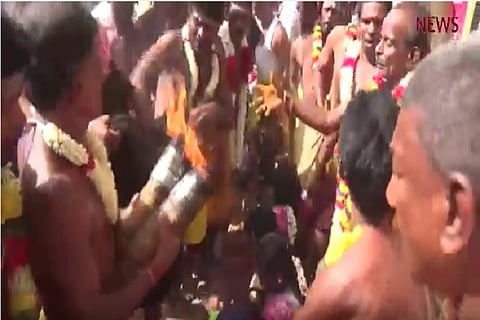 Going (coco)nuts over God, again: Watch devotees get their head slammed by a priest in TN