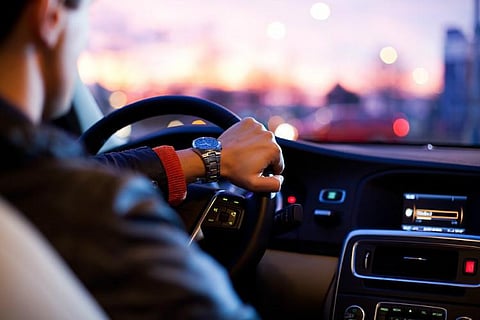 A driver holding the steering wheel