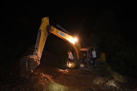 Earthmover used by Karantaka authorites to stop easy flow of traffic from Kerala to Karantaka in Dakshina Kannada district