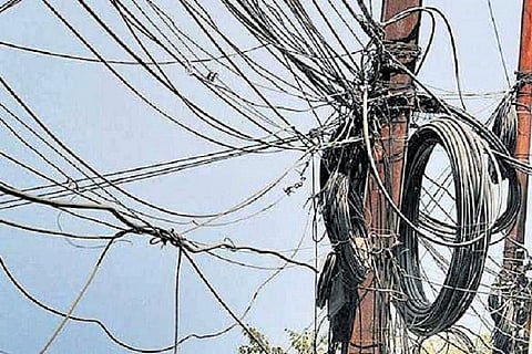 Cable wires hanging from a transformer