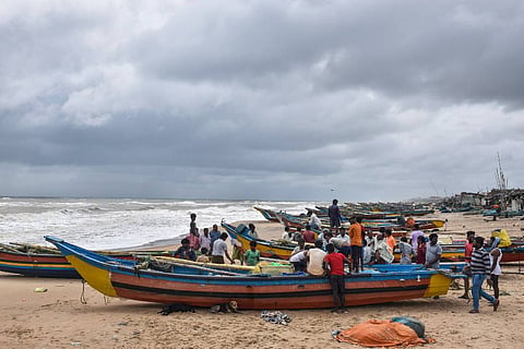 Fishermen park their boats on the Puri beach ahead of Cyclone Gulab