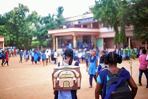 Girl students making their way into a school in Karnataka