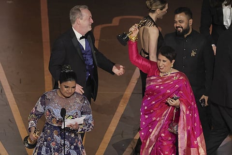 Guneet Monga and Kartiki Gonsalves at the Academy Awards