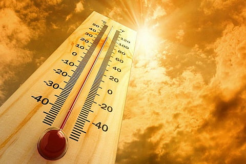 A file image showing a thermostat under the sun, representative of hot weather