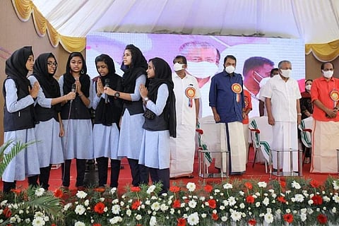 Girls in hijab sing prayer
