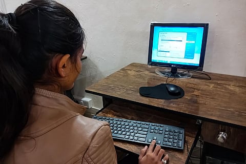 Woman working at a computer