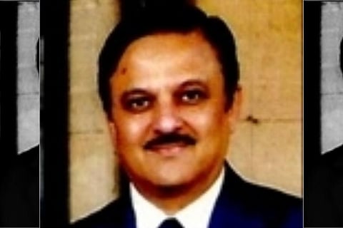 Chief Justice Oka wearing black suit and facing the camera