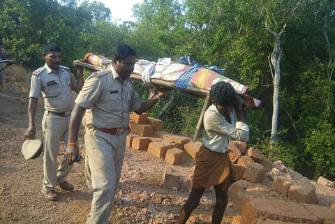 Karnataka cops carry dead body of 80-year-old down a hill after locals refuse