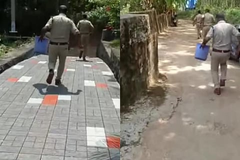 Police officers with the drum where the baby was left