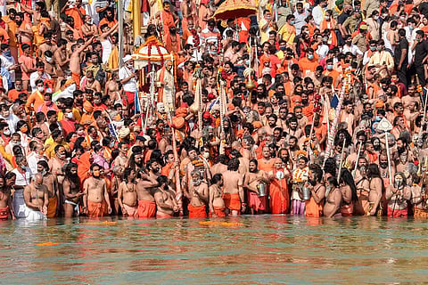 Scores of participants of Kumbh Mela taking dip in water without abiding COVID-19 protocol
