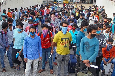 Migrant workers waiting to go home