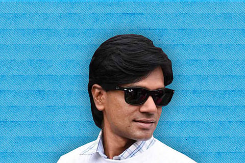 File image of Alt News co-founder Mohammed Zubair against a blue background