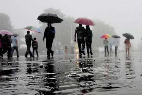 Representa ive image of people holding umbrellas on a rainy day