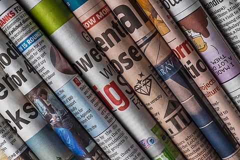 Newspapers rolled and displayed 