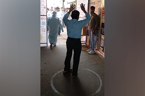 Now, a disinfection tunnel sprays an organic fumigant in Karnataka