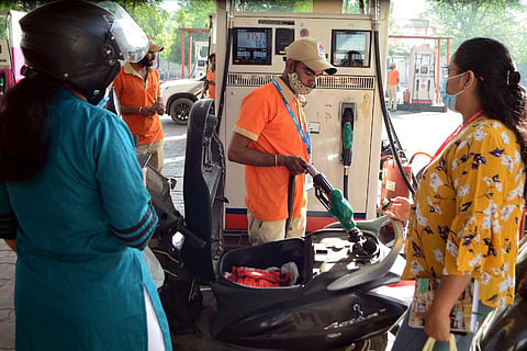 Customers at a fuel station:  TN retail outlets won’t buy fuel from OMCs on May 31 in protest against Union govt