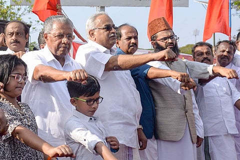 Photo of Kerala Chief Minister Pinarayi Vijayan surrounded by people. 