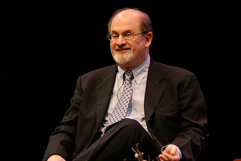 Salman Rushdie dressed in suit