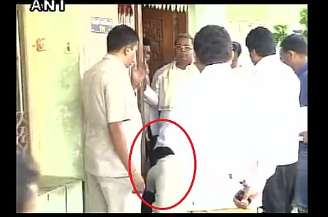 Controversy erupts over video showing a man tying Karnataka CM’s shoelaces for him