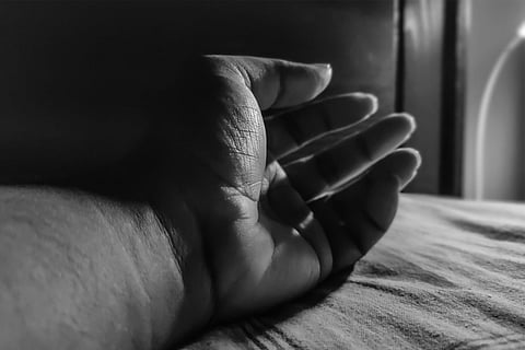 Hand of a person in black and white