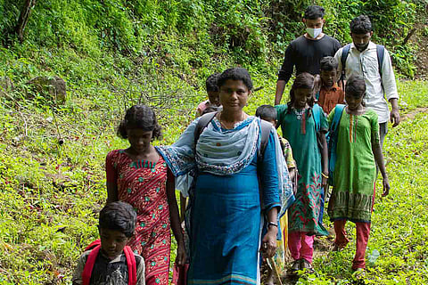 Mini teacher with her students in forest
