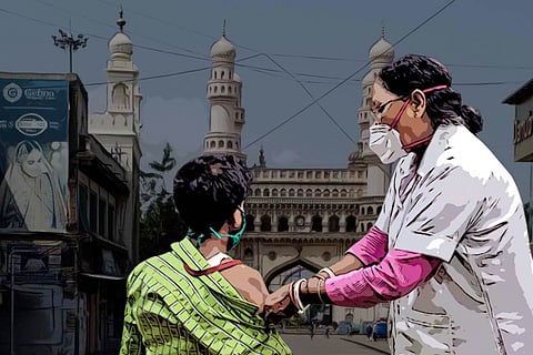 A man being vaccinated and a Charminar in the background