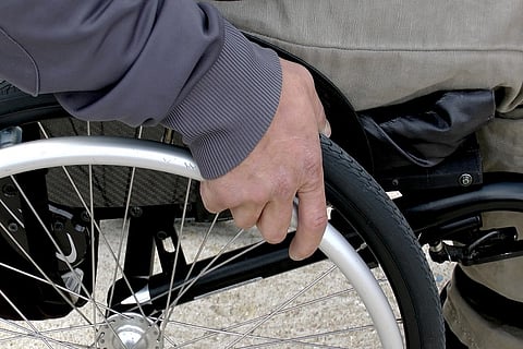 Wheelchair-bound activist who helped draft airport guidelines made to stand up for security check