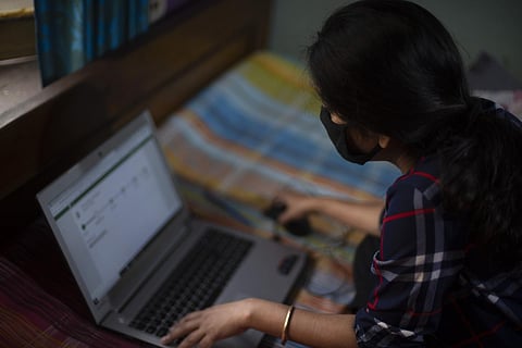 Representative image of a woman working on a laptop 