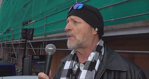 Brian Kidder speaks at a protest December 12, 2020