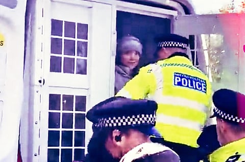 Greta Thunberg is hauled off in a paddy wagon in London Tuesday.