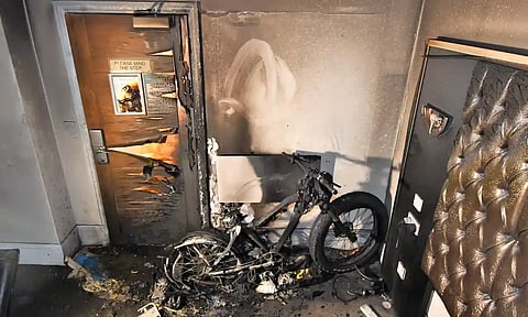 Remains of an electric bike that caught fire while on charge in a hotel room in Liverpool.