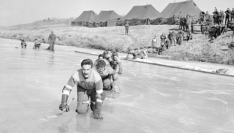 Canadian soldiers setting up to play hockey on the frozen Imjin River in 1951, during the Korean War. Writer  Michael Kim reflects on what that means to him today, as a Canadian of Korean extraction.