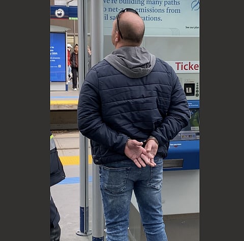 EXCLUSIVE: On of the Calgary brothers in handcuffs after they were hauled off the LRT