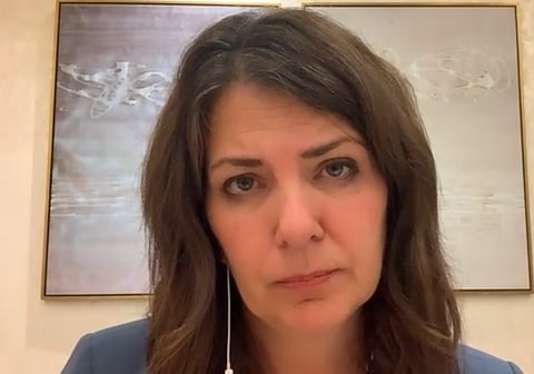 Premier Danielle Smith in a press conference from Dubai