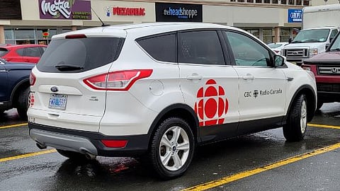 CBC vehicle parked at Fall River, NS parking lot adjacent to liquor store.