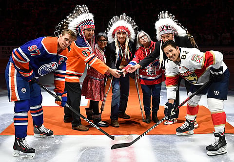 Willie Littlechild, centre, has been appointed to Order of Canada