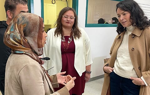 Edmonton MP Heather McPherson and Alberta NDP leadership candidate Sarah Hoffman talk with a Muslim woman. McPherson was recently a guest of West Bank officials, one of five MPs who were part of a fact-finding visit there