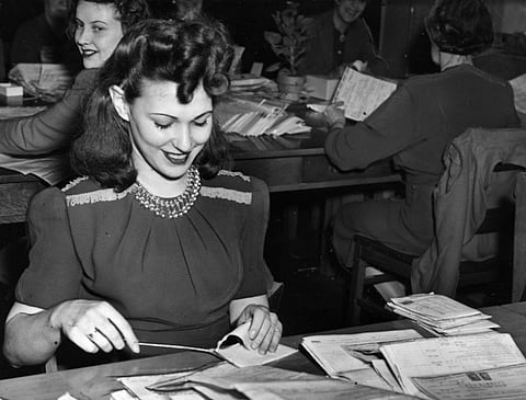 Tax form sorter, Pearl Elliott, in 1945 at the Dominion Government building on Front Street. 