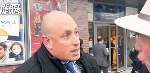 David Menzies was arrested by police officers after he tried to ask Chrystia Freeland questions.