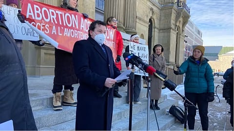 Clinic 554 medical director Dr. Adrian Edgar in a media event in front of the New Brunswick legislature