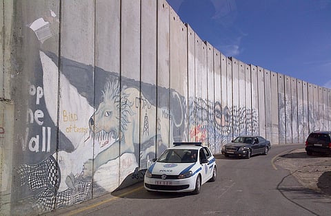 A high wall divides Israel from West Bank, underlining the distance between Israel and its Palestinian neighbours. A 'two-state solution' looks unlikely.