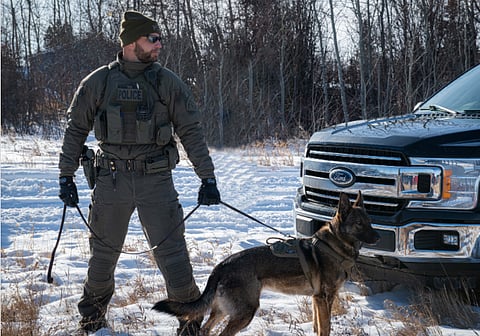 Sask RCMP officer with his canine partner
