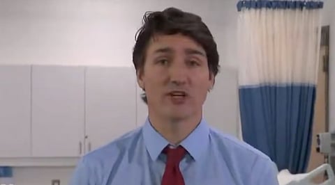 Justin Trudeau said he is furious over Bell Media's layoffs, calling it "a garbage decision." 