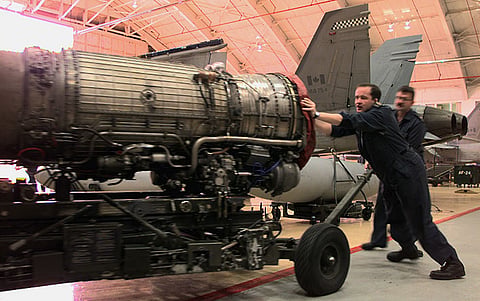 Aircraft technicians of 441 Fighter Squadron push a CF-18 Hornet engine on an engine cart through the CF-18 hangar at 4 Wing Cold Lake. Writer John Thomson asserts however, that the entire Canadian Armed Forces is 'dilapidated' and fast approaching irrelevance. 