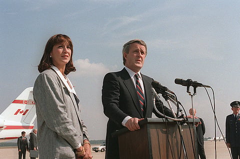 Former prime minister Brian Mulroney bids farewell to dignitaries after a state visit.