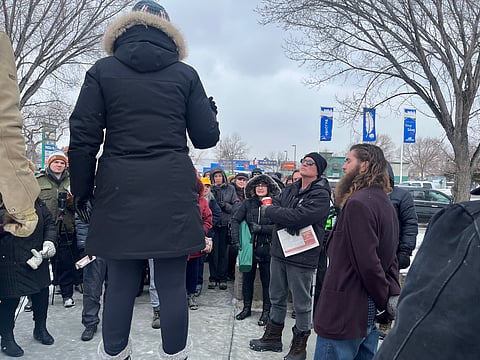About 80 people gathered in Edmonton to protest against Elections Alberta launching an investigation into Take Back Alberta. 