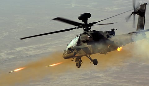 A British Army Apache attack helicopter in Afghanistan fires rockets at insurgents during a patrol in 2008.