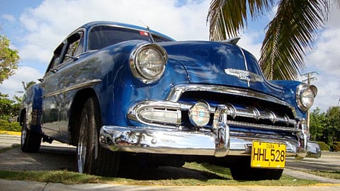 A typical scene of a classic car in Cuba — an economy that has never been viable.